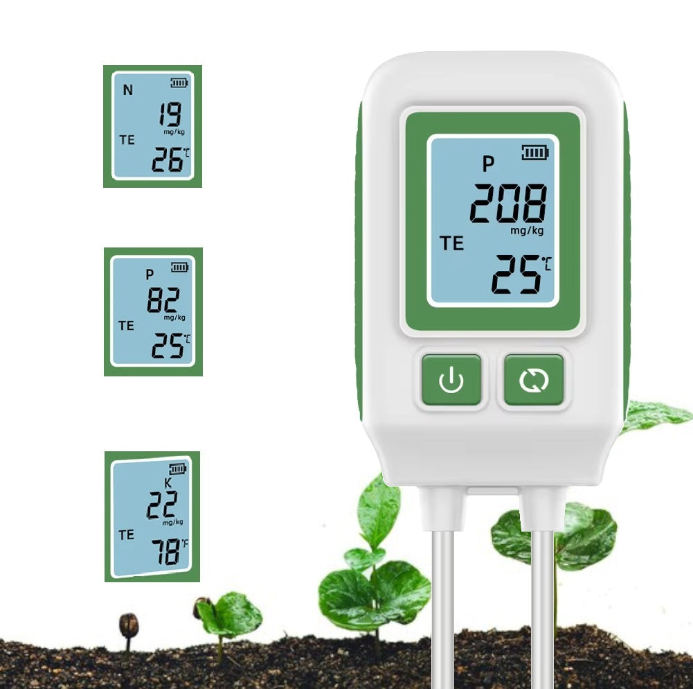 Digital NPK soil meter placed in the ground, providing temperature readings for plant growth monitoring.