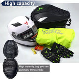 Essential motorcycle gear including a helmet, gloves, and a waterproof tail bag, all set for an adventure.