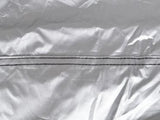 Silver motorcycle cover tarp with a zipper, providing protection and easy access for your bike. 