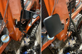 Two pictures of a tractor highlighting its side mirror, emphasizing its agricultural utility and features.
